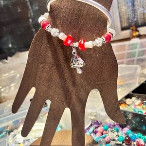 Red and white glass mushrooms and beads with steal wire bracelet